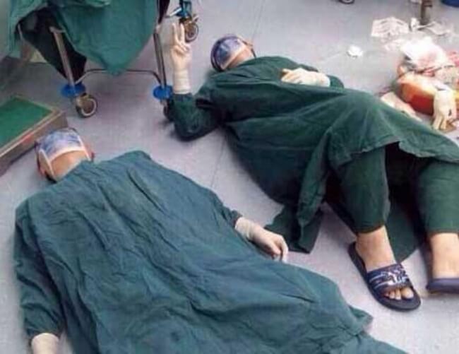 15 Pictures That Prove How Incredibly Powerful The Human Soul Can Be - Doctors resting after 32 hours of surgery.