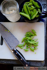 photo of sugar snap peas sliced on the diagonal