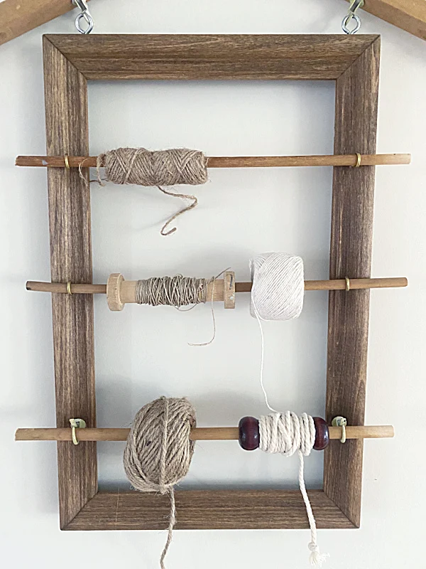 frame with spools of twine