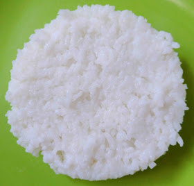 Using damp hands gently press the rice to form a thin round or oval patty