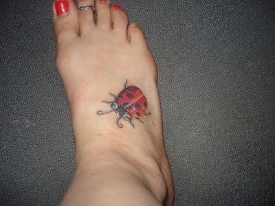 Big ladybug tattoo on foot