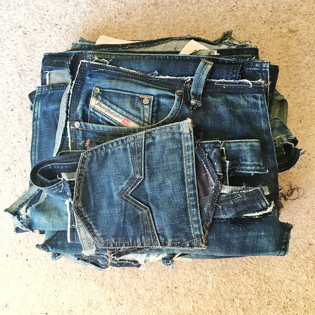 Pile of denim jeans