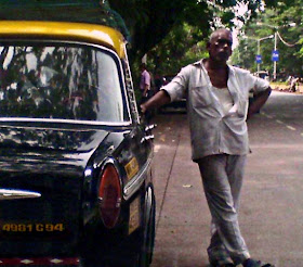 taxi driver standing near taxi