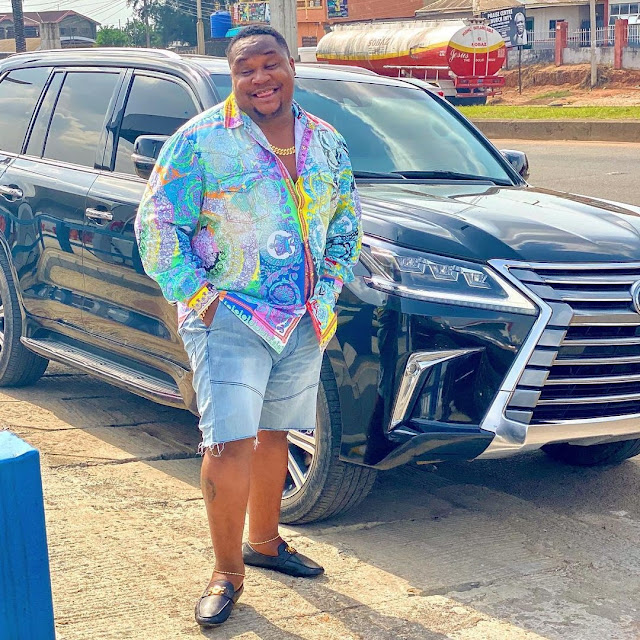 ‘Unbothered Lesbian In Versace’ - Cubana Chiefpriest Poses With Multi-Million Naira Prado Jeep