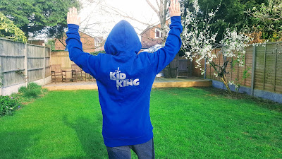 Dan Jon wearing his The Kid Who Would Be King Hoodie whilst being circled by a Police Helicopter
