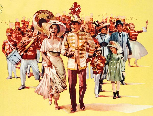 movie poster of a woman in old-fashioned summer clothes (white dress, broad-brimmed white hat) taking the arm of a man in a band uniform. Around them are several townspeople, and behind them all a marching band