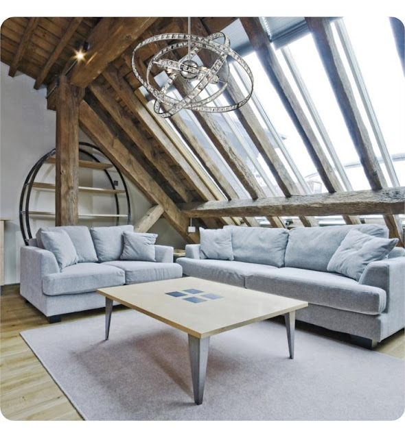 Loft living room with unique pendant chandelier lighting.