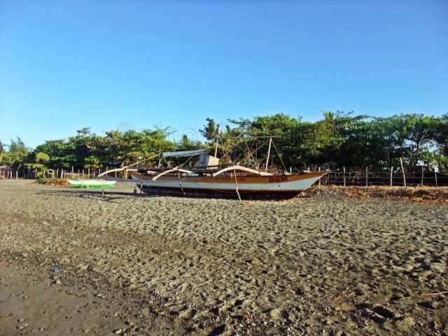 boats on dry land at Aroma Beach San Jose Occidental Mindoro