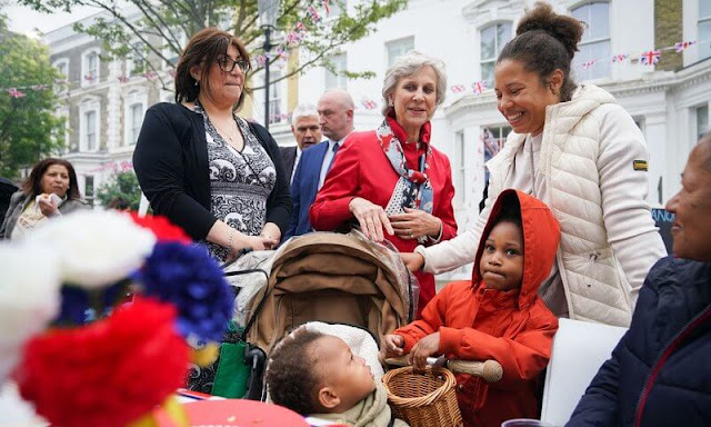 Duchess of Gloucester wore a red coat and white trousers. The Big Help Out was established by some of Britain's leading charities