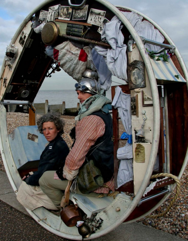 The Wheel House is a live performance in which two acrobatic performers entertain audiences with the slow-paced rolling travel of their mobile home. The interior space of the circular home is designed to look just like a normal house, with doors, windows, curtains, pots and pans, and even a bed. The project is produced by Acrojou Circus Theatre, a group formed in 2006 by artistic directors Jeni Barnard and Barney White. According to their website, the team has so far created six original shows, toured within nine countries, and performed to nearly 60,000 people.