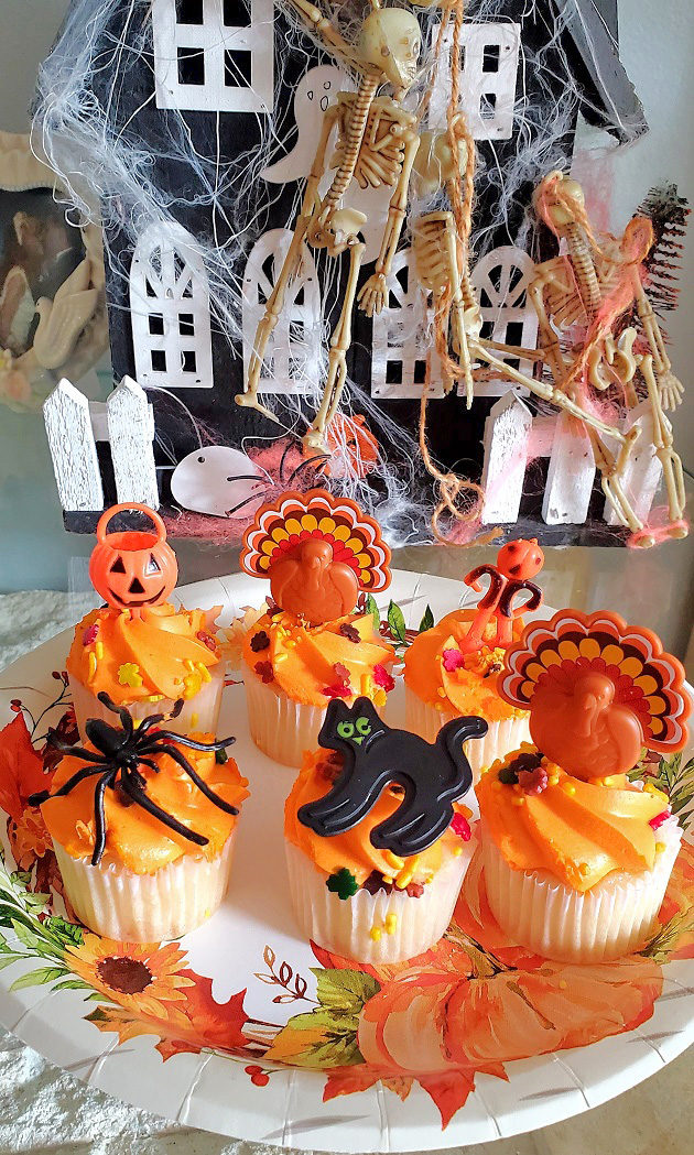 Halloween decor with orange cupcakes