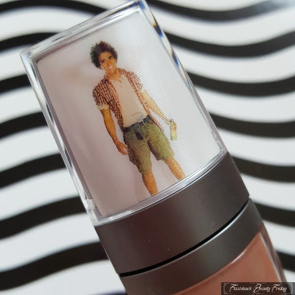 front of lipgloss lid with Kirk dressed lenticular hologram