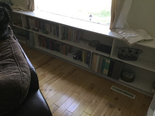 Built in shelving below the window