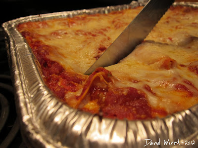 Cutting Homemade Lasagna From the Oven