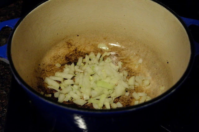 Onion sautéing in the pan.