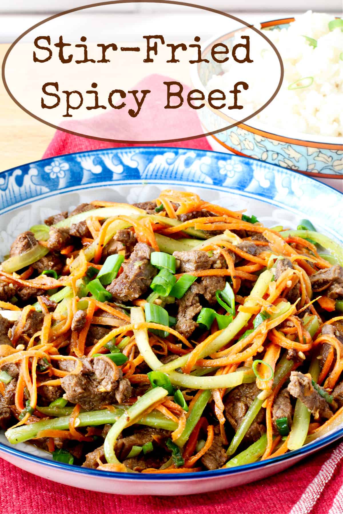 Spicy Stir-Fried Beef in a blue patterned bowl.