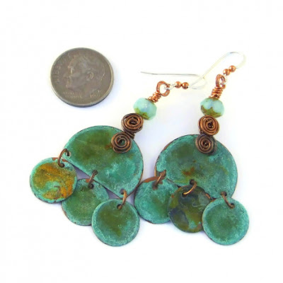 The Boho Love earrings shown with a dime for size comparison.