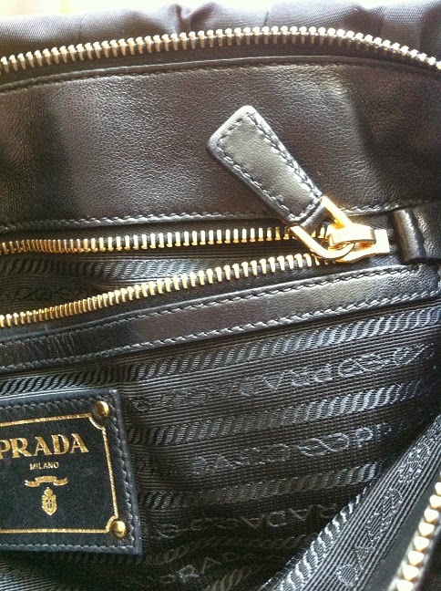 ... have the prada logo poorly stamped hard to read logos prada stitching