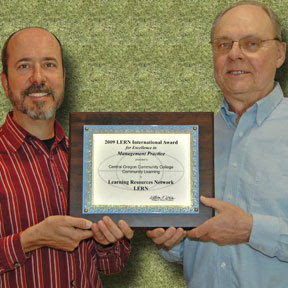 Paul Stennet (L) and Tom McDannold (R) displaying the award from LERN