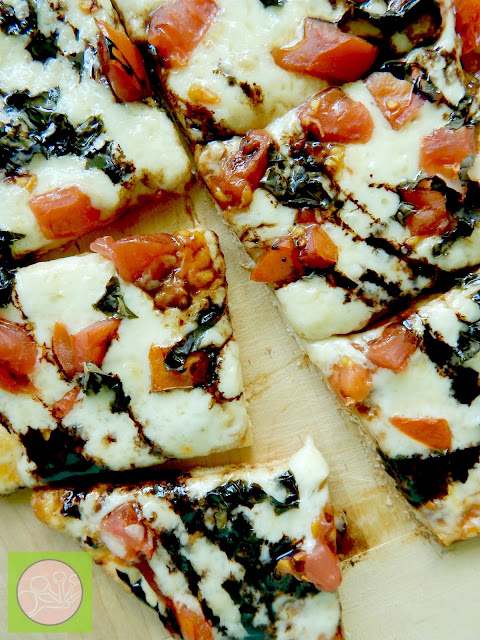 margarita pizza with balsamic drizzle (sweetandsavoryfood.com)