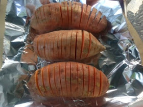 sweet potatoes sliced on cookie sheet