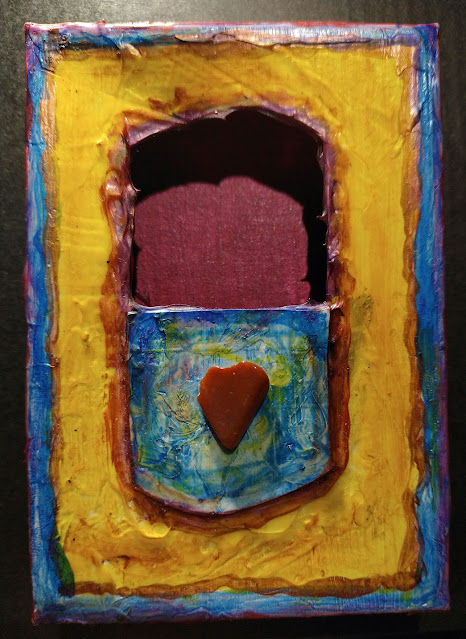 Altered art box with heart shaped stone and painted surface