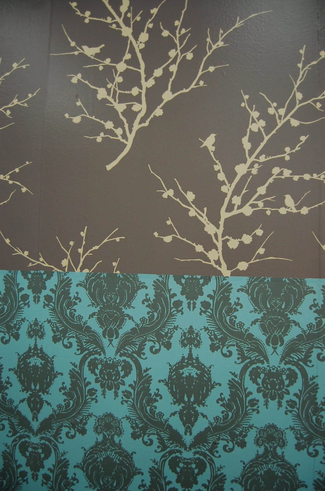Tempaper is temporary wallpaper that is self adhesive and repositionable.