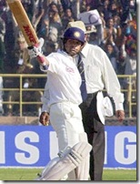 Tendulkar acknowledges the crowd on reaching his century