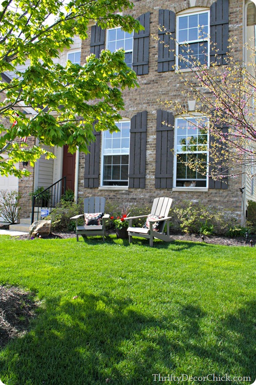 adirondack chairs in front of house