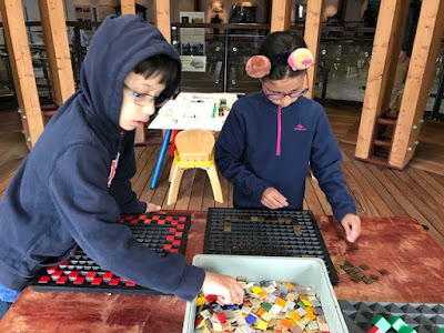 Children doing a mosaic activity at a Roman Villa