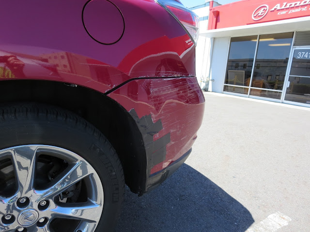 Dent & scrapes on bumper and quarter panel before auto body repairs.