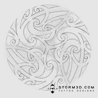 maori wood carving design on spinning wheel