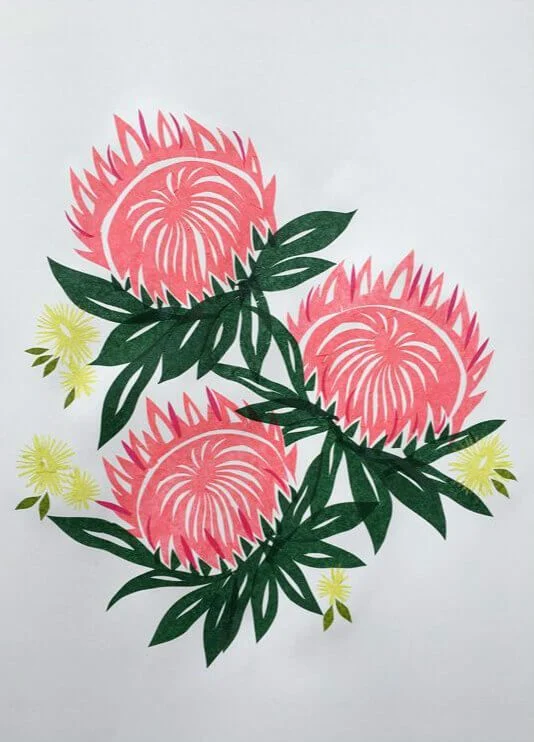 pink paper cut protea blossoms with green leaves and yellow buds