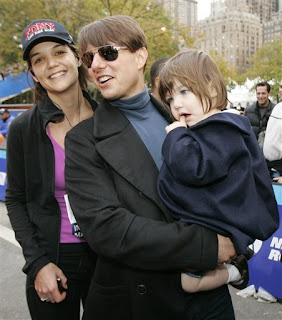 Katie Holmes meets Tom Cruise and Suri at the finish line