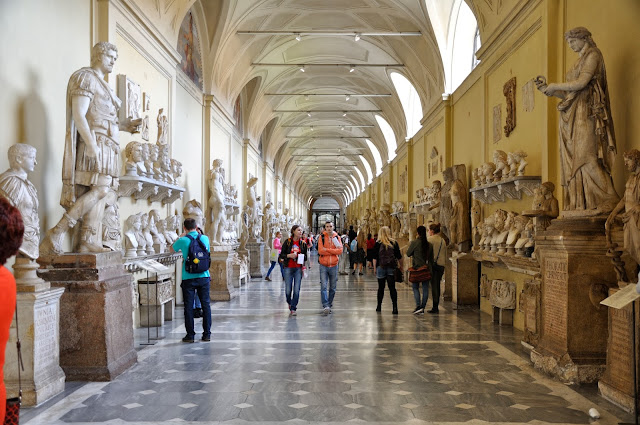 Corridor filled with statues and busts at the Vatican Museum