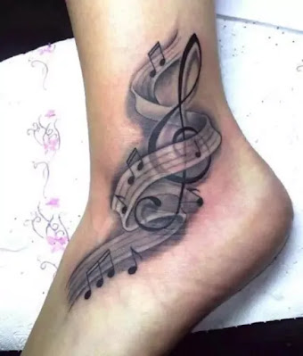 Fine Musical Note Tattoos On Forearm