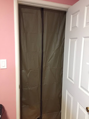 Interior door frame with split curtain covering the gap