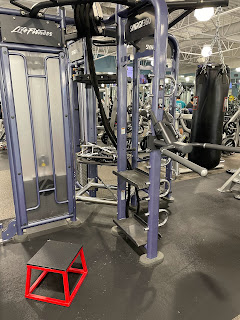 Separate equipment rack with pulleys, rope, and heavy bag