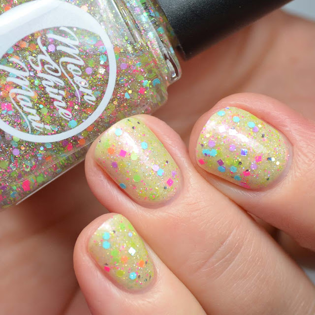 neon glitter nail polish topper swatched over yellow