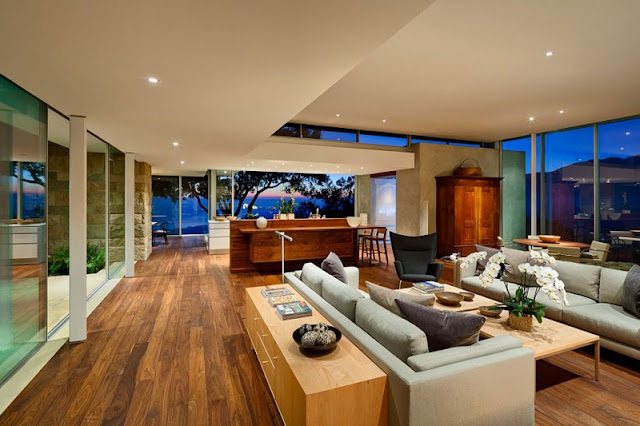 Interior View of the Home with Simple Kitchen and the Cozy Sitting Space