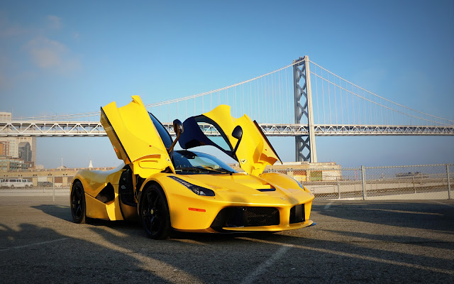 Yellow Ferrari LaFerrari with Doors Open in Front of Bridge