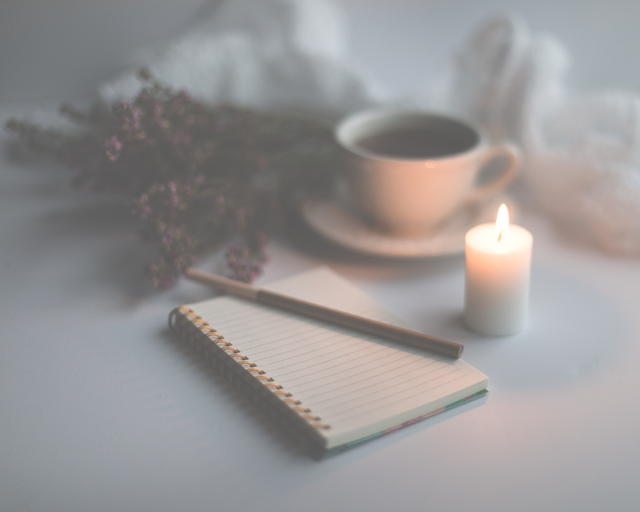 journal candle and tea
