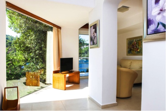 A nice, light home featuring a selection of framed art on the walls.