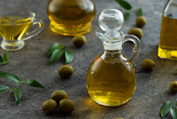 Image by <a href="https://www.freepik.com/free-photo/high-view-bottles-filled-with-olive-oil-marble-background_5486622.htm#query=vegetable%20oil&position=6&from_view=search&track=sph">Freepik</a>
