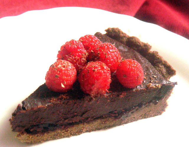 Dark Chocolate Truffle Tart with Mixed Berries in a Teff Crust
