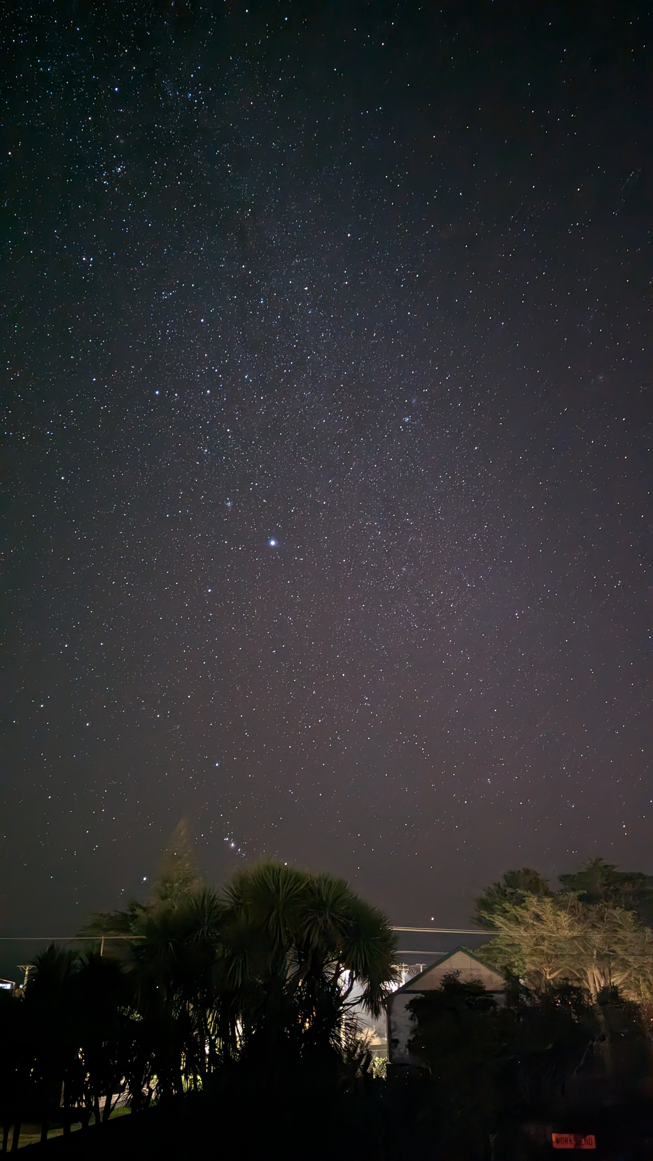 The Milky Way above the house and trees. TAP/CLICK to find the movement video.