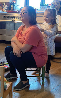 Rosie brushing Angela's hair