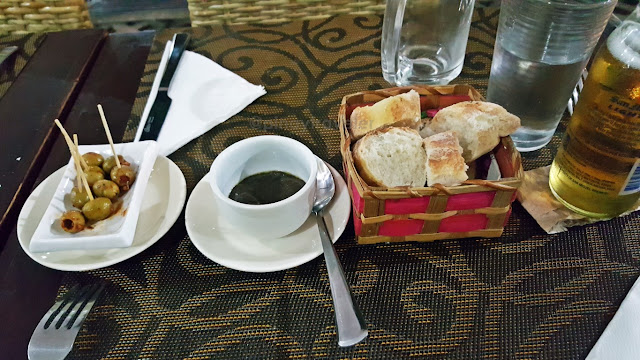 inhouse-baked bread, olives and vinaigrette as appetizer at the outside dining area of Bon Appetit French Restaurant in Davao City