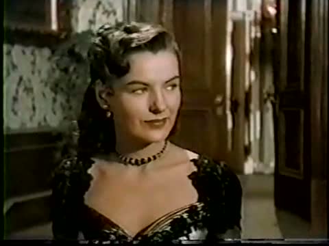 And here are two pictures of Ella Raines from Singing Guns