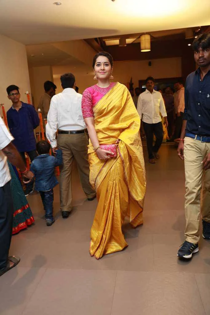 Rashi Khanna Photos In Yellow Saree At Director Krish Marriage